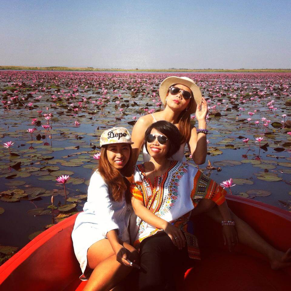 Teacher Pear and her friends on a boat among amazing pink lotuses.